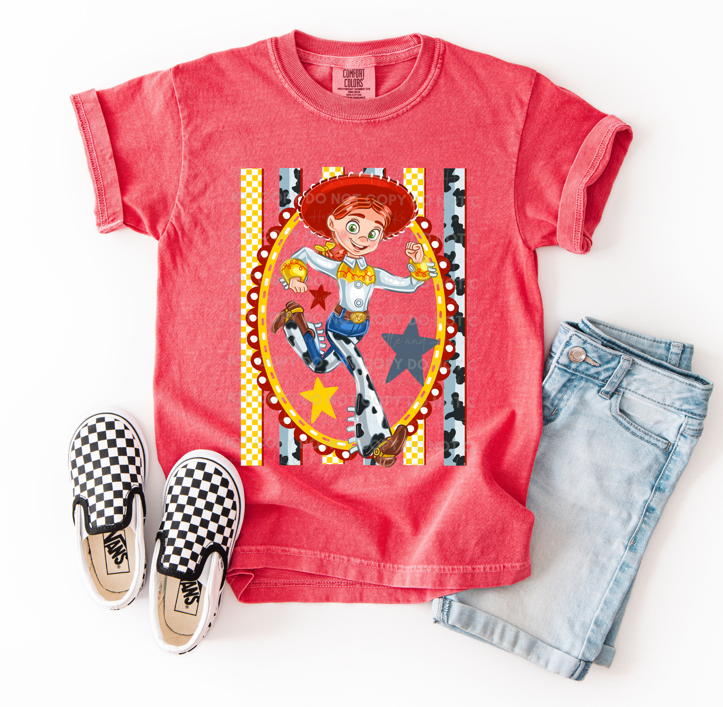 Jessie-inspired cowgirl character design printed on a Comfort Colors® t-shirt with western details, stars, and patterned accents.