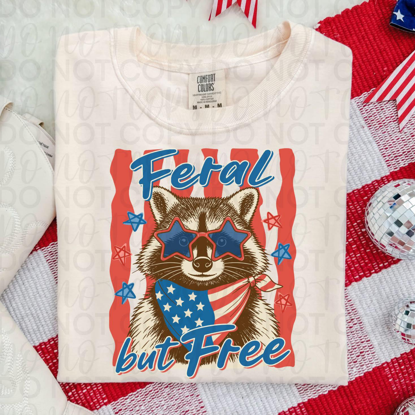 Feral but Free Patriotic Raccoon Graphic Tee
