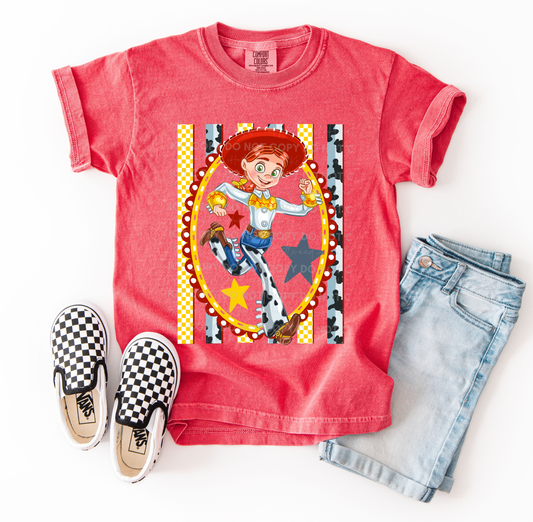 Jessie-inspired cowgirl character design printed on a Comfort Colors® t-shirt with western details, stars, and patterned accents.