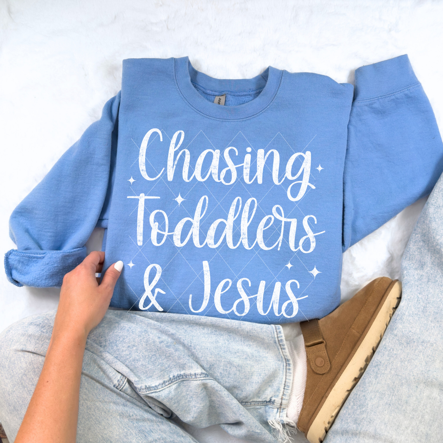 Chasing Toddlers & Jesus sweatshirt in Carolina Blue — Christian mom graphic sweatshirt in flat-lay display