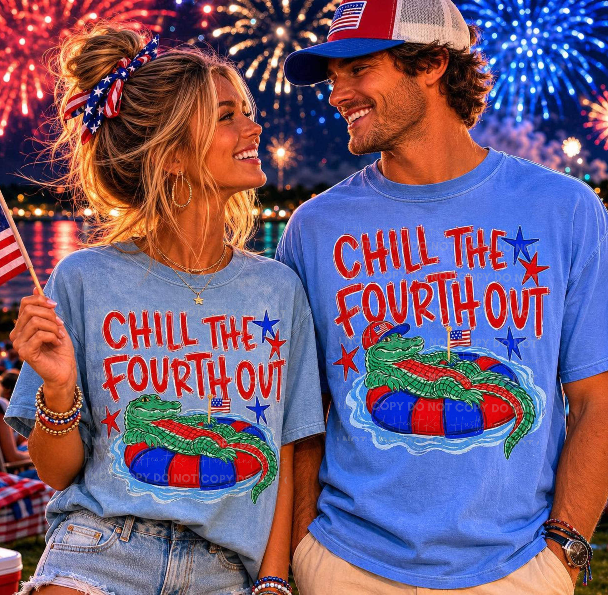 Man and woman wearing blue Comfort Colors patriotic shirts featuring a relaxed alligator floating in a red, white, and blue tube with the phrase "Chill The Fourth Out" against a fireworks display backdrop.