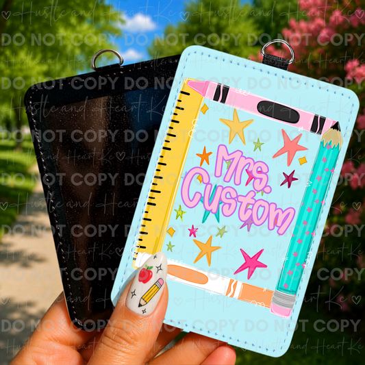 Teacher badge reel with colorful school supplies and personalized name.