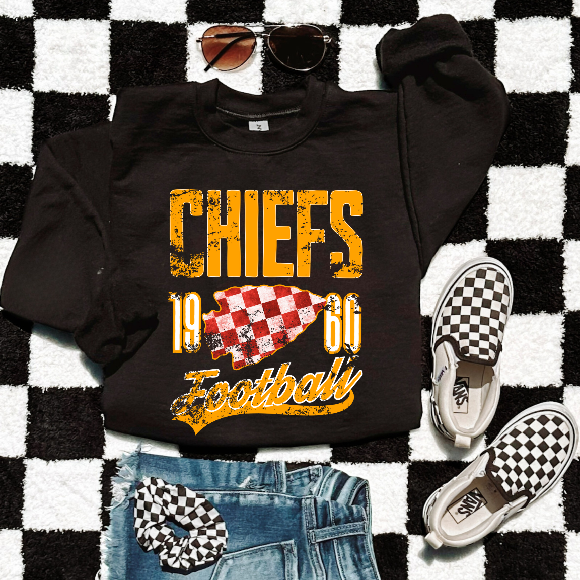 Black Chiefs 1960 distressed sweatshirt with gold lettering and red checkered arrowhead.