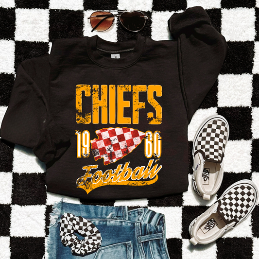 Black Chiefs 1960 distressed sweatshirt with gold lettering and red checkered arrowhead.