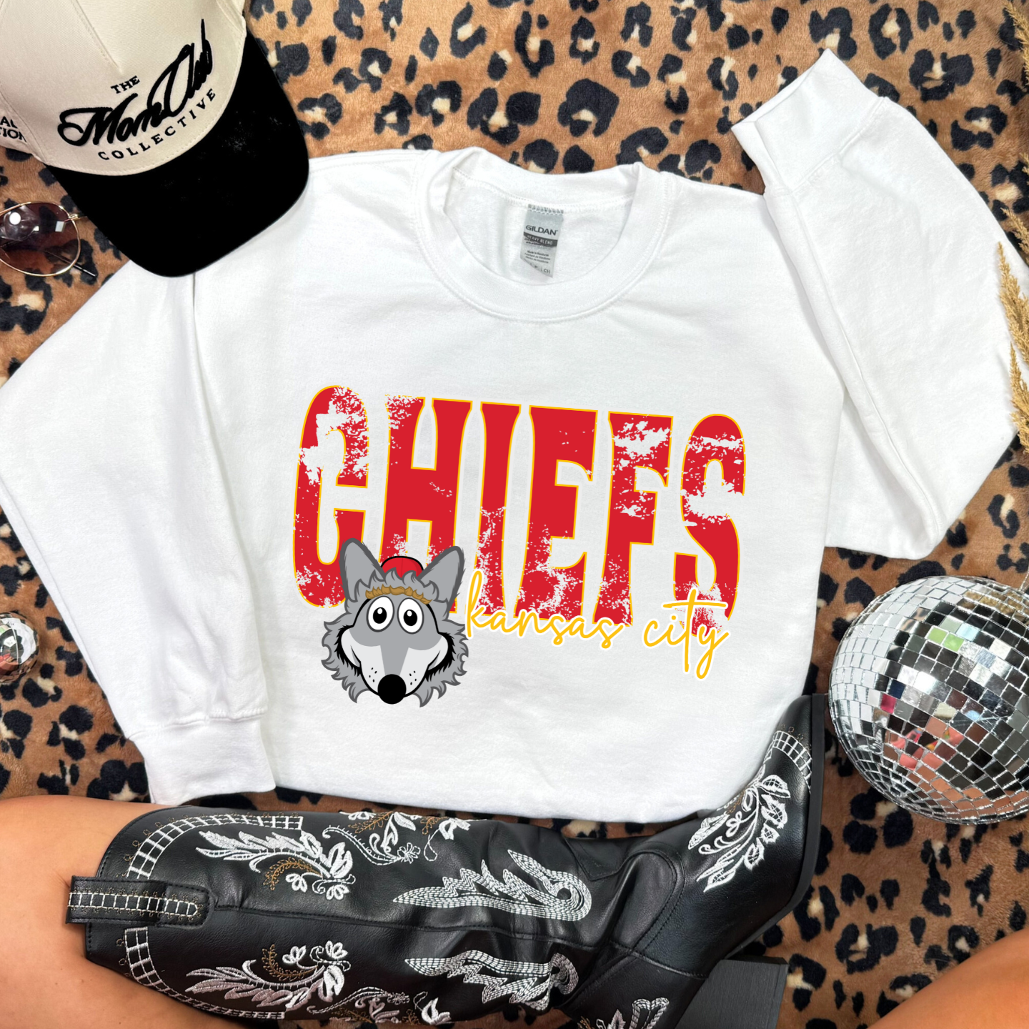 Youth White Kansas City sweatshirt featuring KC Wolf mascot design.