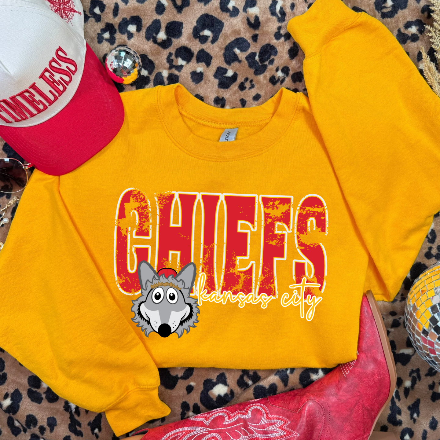 Youth Gold KC Chiefs sweatshirt with distressed lettering and Wolf print.