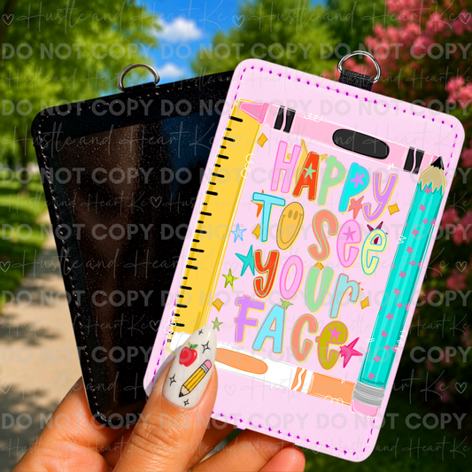 Teacher badge reel featuring Happy To See Your Face design with colorful school supplies.
