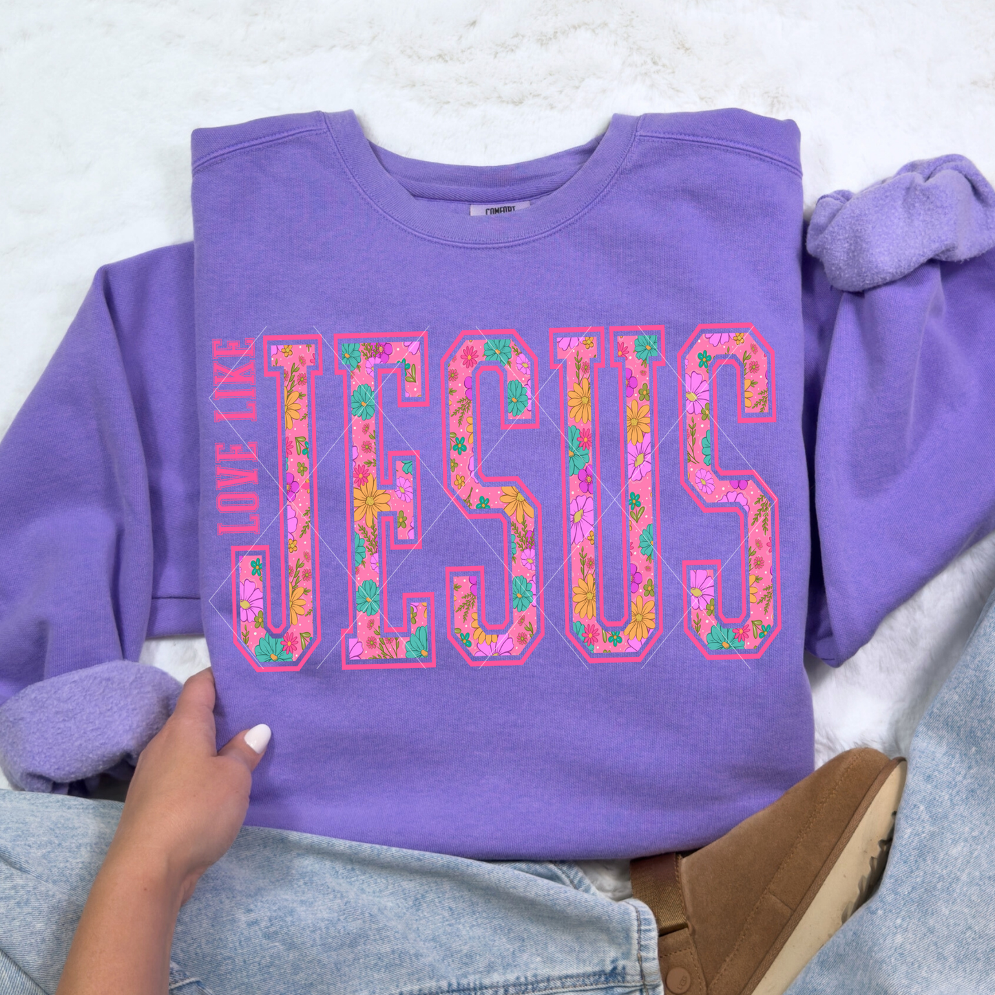 Violet Love Like Jesus sweatshirt with floral varsity lettering styled with cozy jeans and slippers