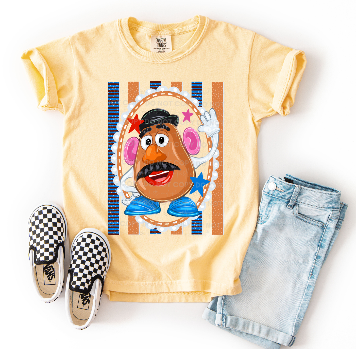Mr. Potato Head-inspired character design printed on a Comfort Colors® t-shirt featuring colorful retro accents, stars, and playful details, perfect for Disney vacations and Toy Story fans.