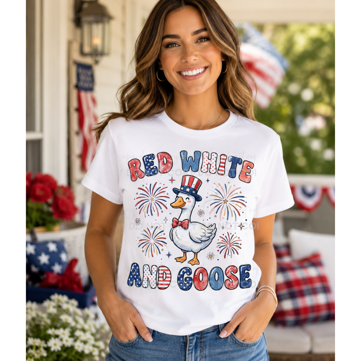 Woman wearing a white patriotic graphic tee featuring a cute goose in red, white, and blue accessories with fireworks and the phrase Red White and Goose.