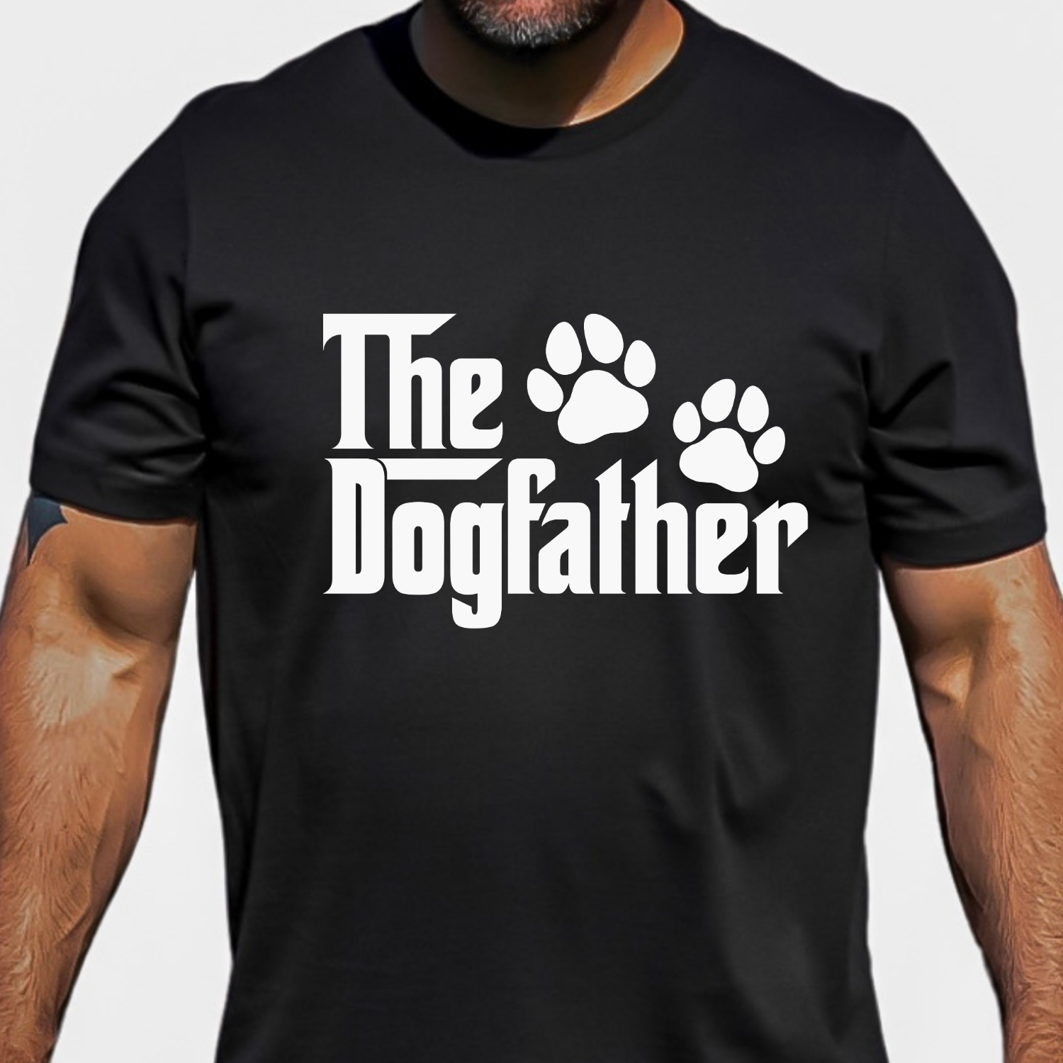 Black shirt featuring The Dogfather graphic with paw prints, designed for dog dads and dog lovers.