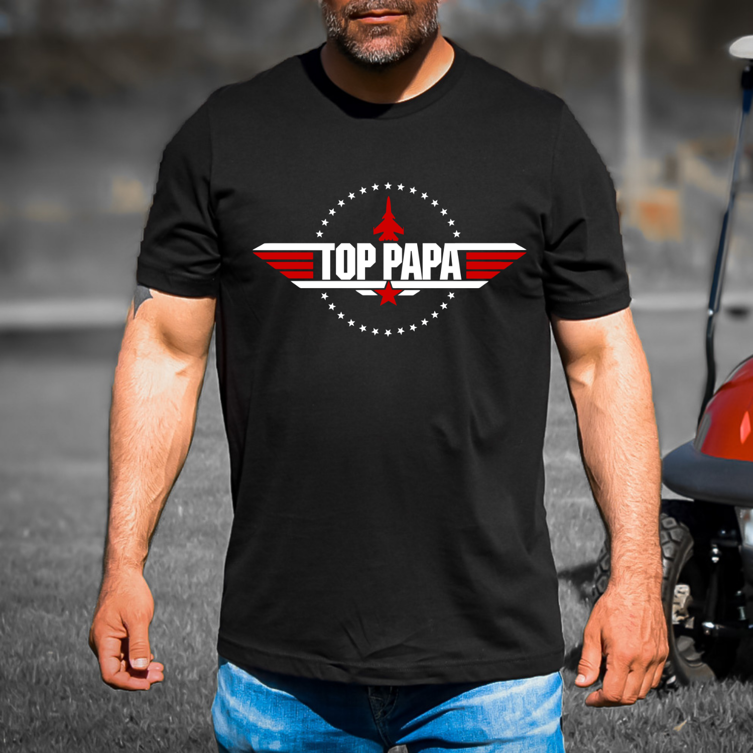 Top Papa patriotic aviation graphic t-shirt featuring a red, white and blue military-inspired emblem with jet silhouette on black shirt.