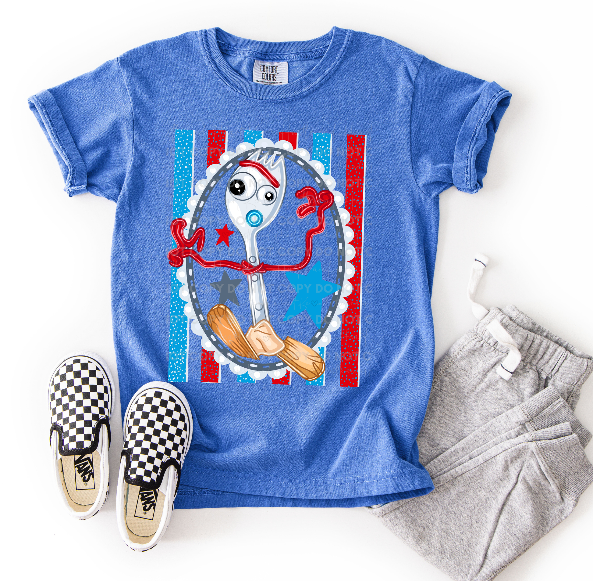 Forky-inspired character design printed on a Comfort Colors t-shirt featuring colorful stars, stripes, and playful details, perfect for Disney vacations, Toy Story fans, and family matching outfits.