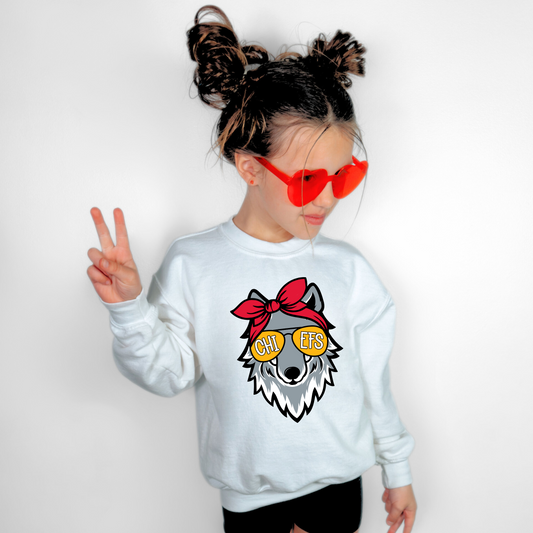 Youth White Kansas City sweatshirt with Wolf Girl mascot design.